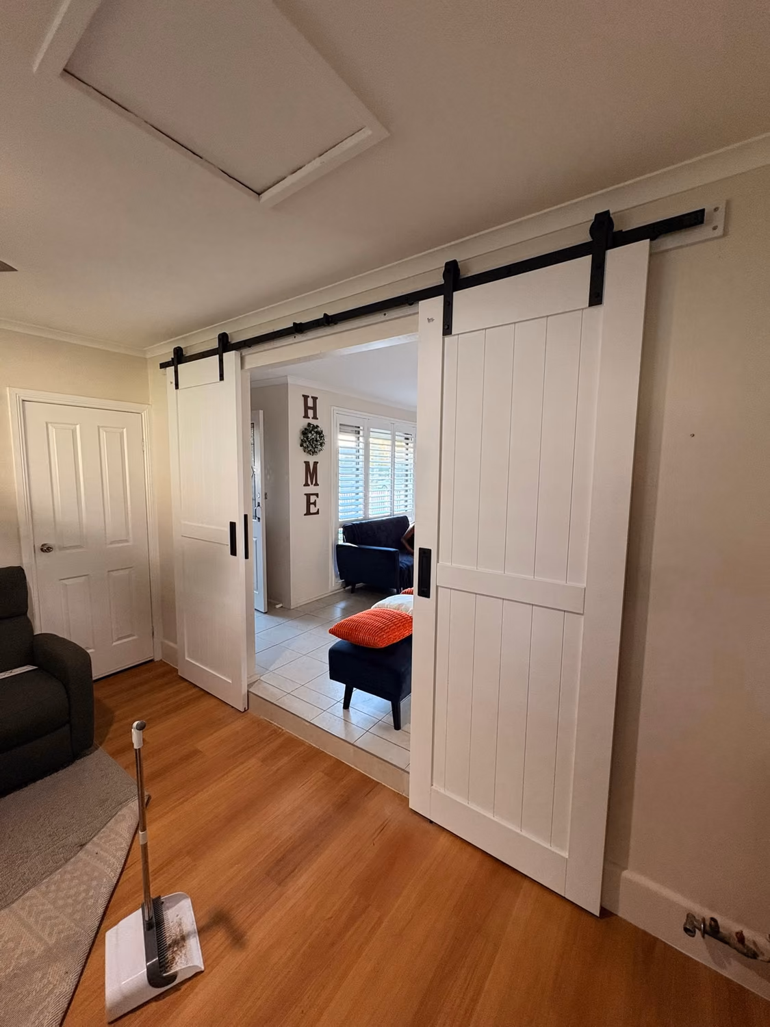Custom-built interior barn door and carpentry finished by Julian at Formex Constructions