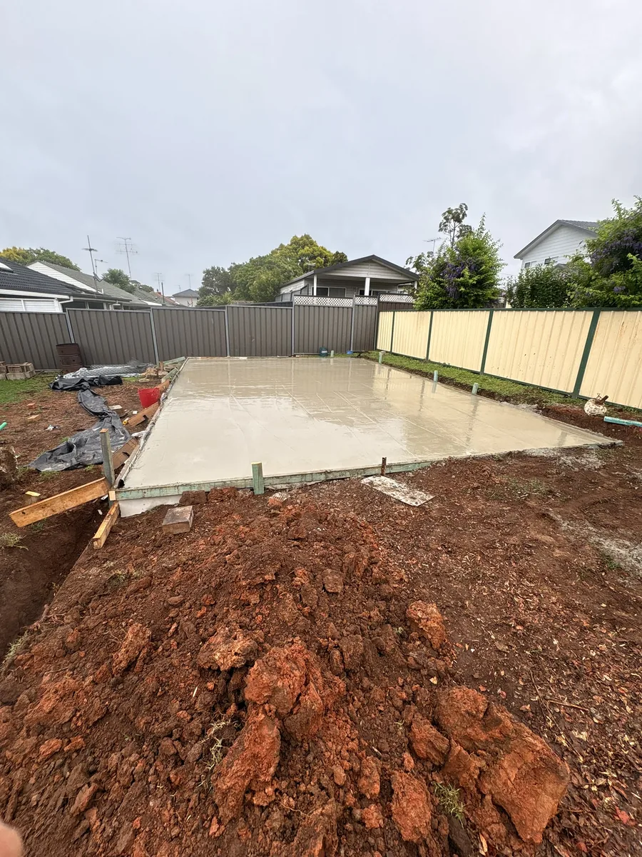 Freshly poured concrete driveway slab at a Western Sydney home