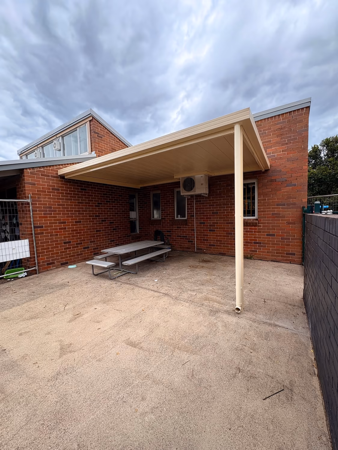Colorbond patio cover attached to a brick home in Western Sydney, built by Formex Constructions