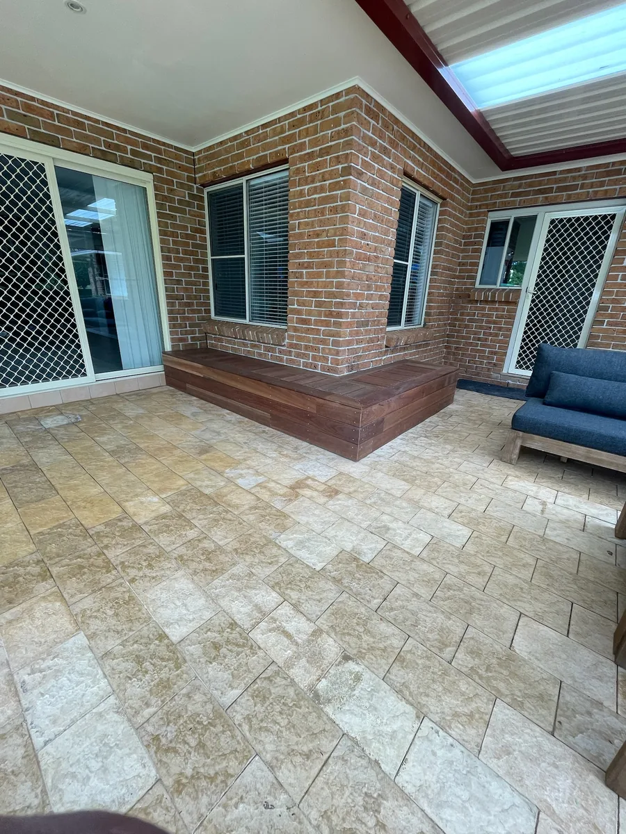 Hardwood timber deck with a step built against a brick home in Western Sydney
